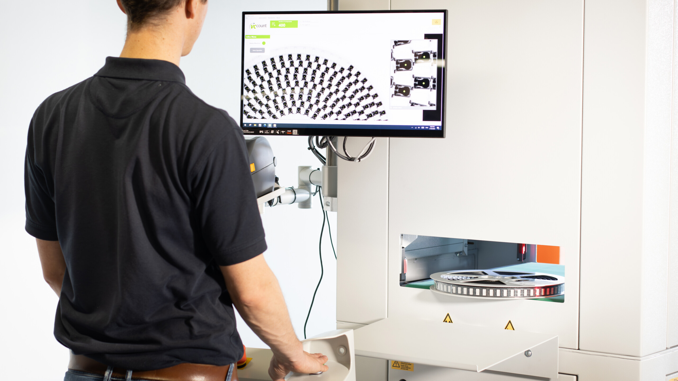 XRHCount Inline with a SMD reel passing through and the scan results shown on the screen