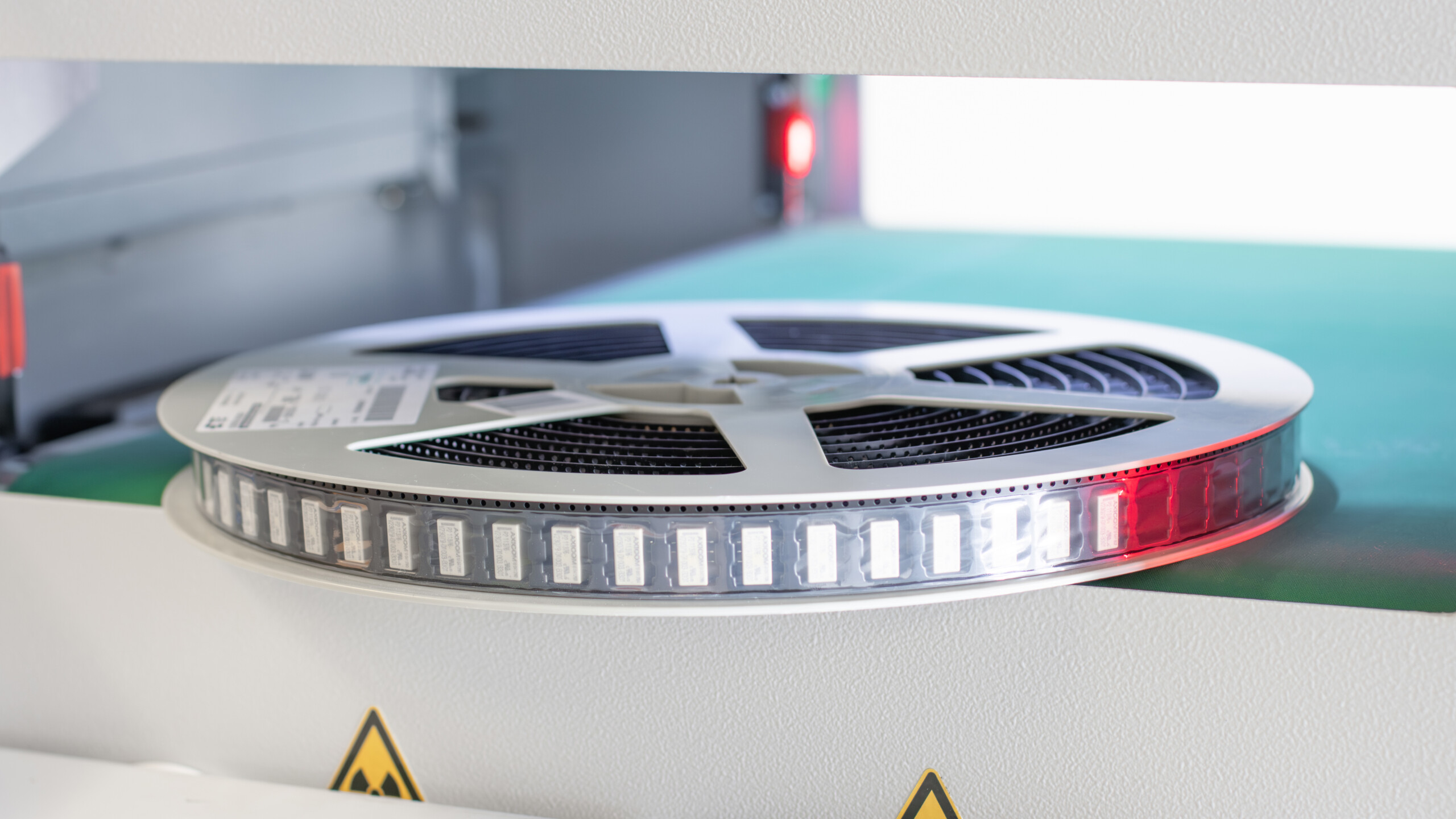 Close-up of an SMD reel passing the XRHCount Inline X-ray process